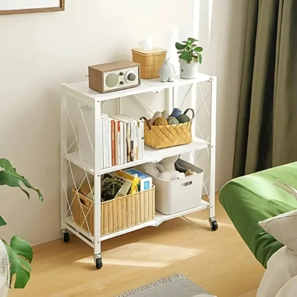 white foldable kitchen storage rack, 3 tier metal shelf with wheels, carbon steel storage rack, white rolling shelf, multipurpose organizer rack, foldable metal shelf for kitchen, 3 tier utility rack, home storage trolley, foldable storage unit with wheels